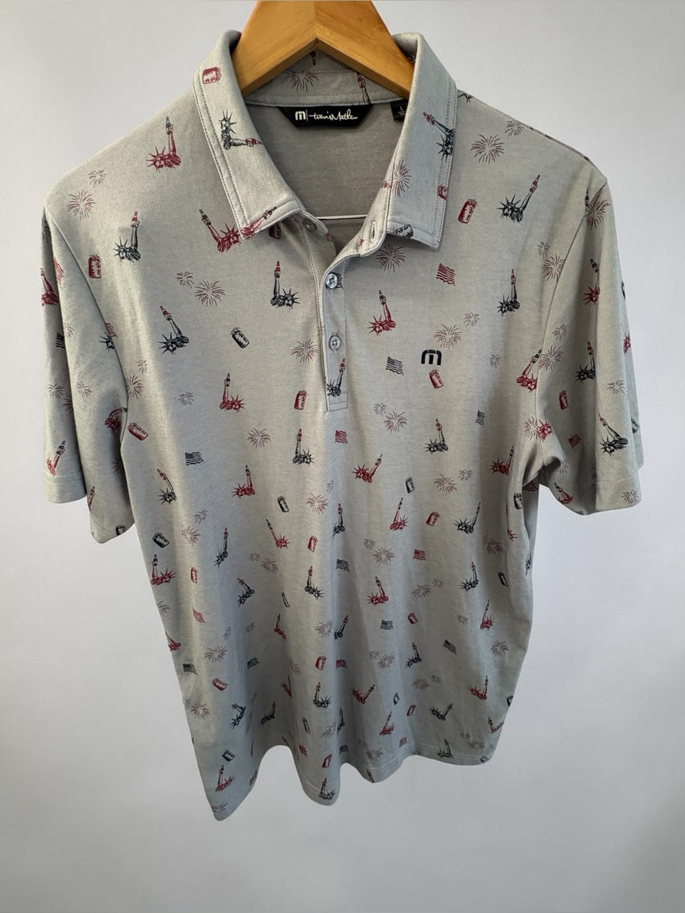 Travis Mathew Light Grey Polo with Red & Blue Print. Perfect for 4th of July!!